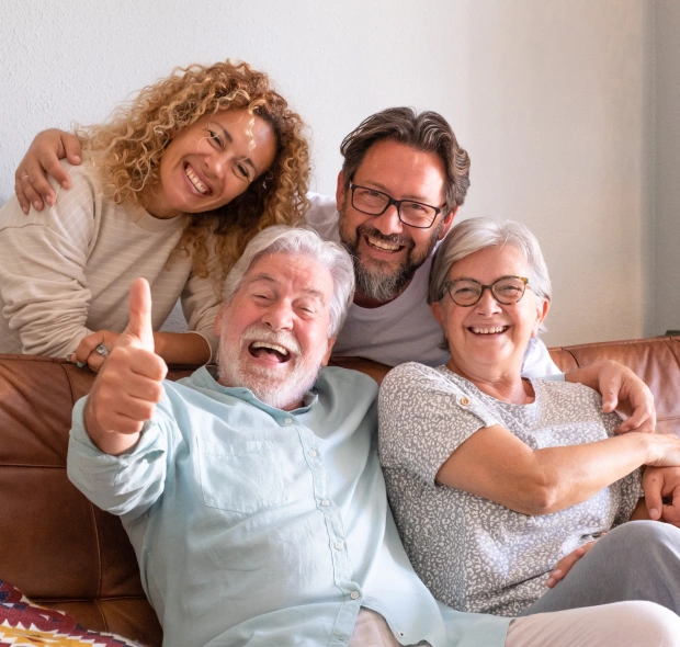 A happy multi generational family smiling together, looking for the best dentist at Chatfield Smiles