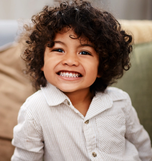 A happy, smiling child highlighting kid-friendly pediatric dentistry at Chatfield Smiles in Littleton